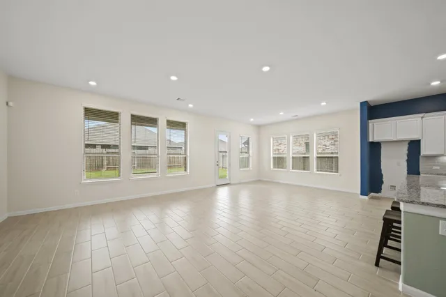 a kitchen with a sink a counter top space stainless steel appliances and cabinets