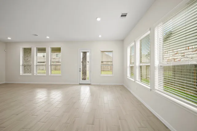 a view of kitchen with stainless steel appliances with kitchen island