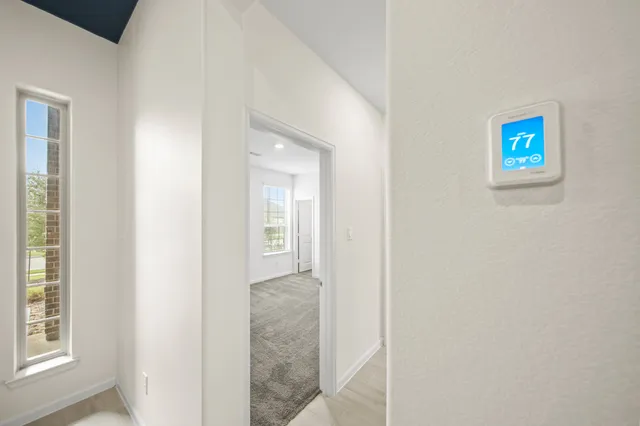 a view of a hallway with windows