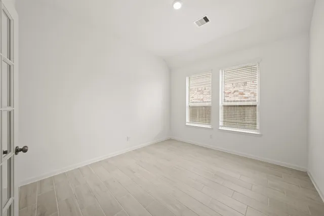 a view of an empty room with a window