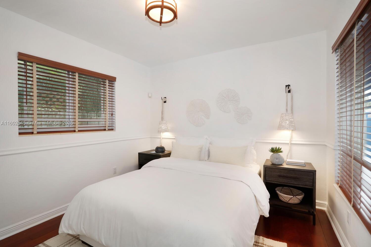 84 Shore Drive West Coconut Grove, FL 33133 - Photo 13 of 21 a bedroom with a bed and a window