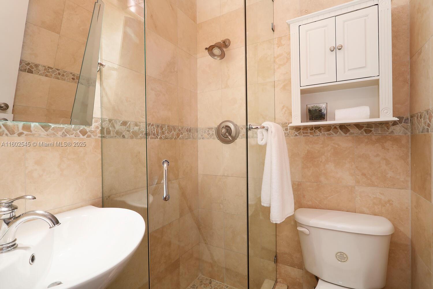 84 Shore Drive West Coconut Grove, FL 33133 - Photo 14 of 21 a bathroom with a sink a toilet and shower