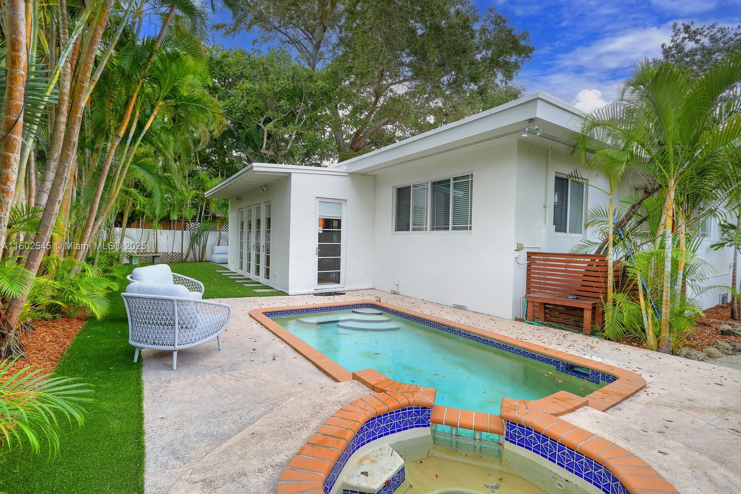 84 Shore Drive West Coconut Grove, FL 33133 - Photo 15 of 21 a view of a backyard with swimming pool