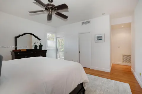 a large bedroom with a bed and a dresser