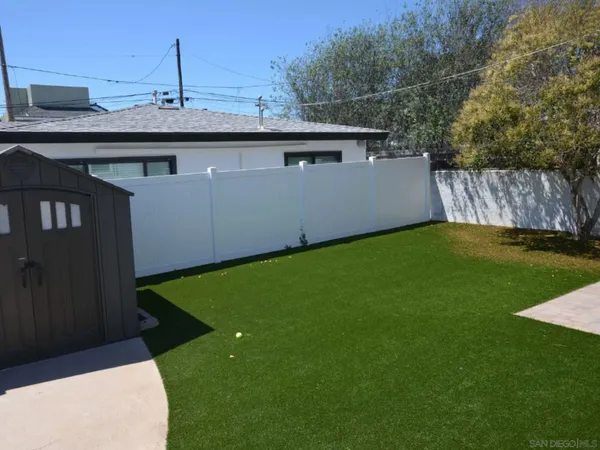 a view of a backyard with a tub