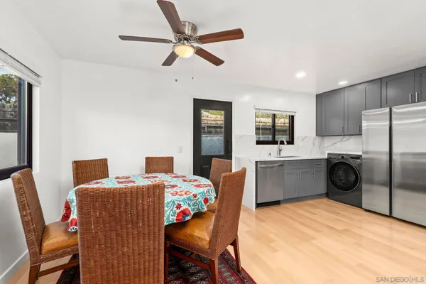 a bedroom with furniture and a flat screen tv