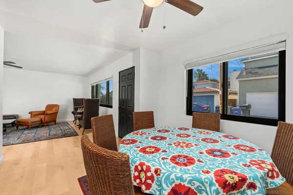a living room with furniture a rug and a chandelier
