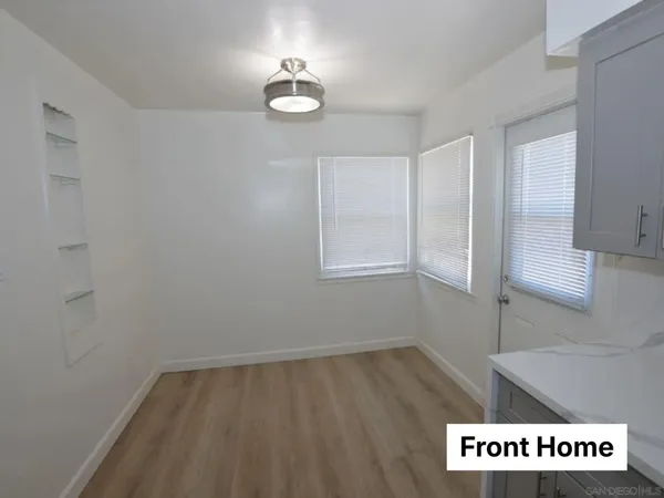 an empty room with wooden floor