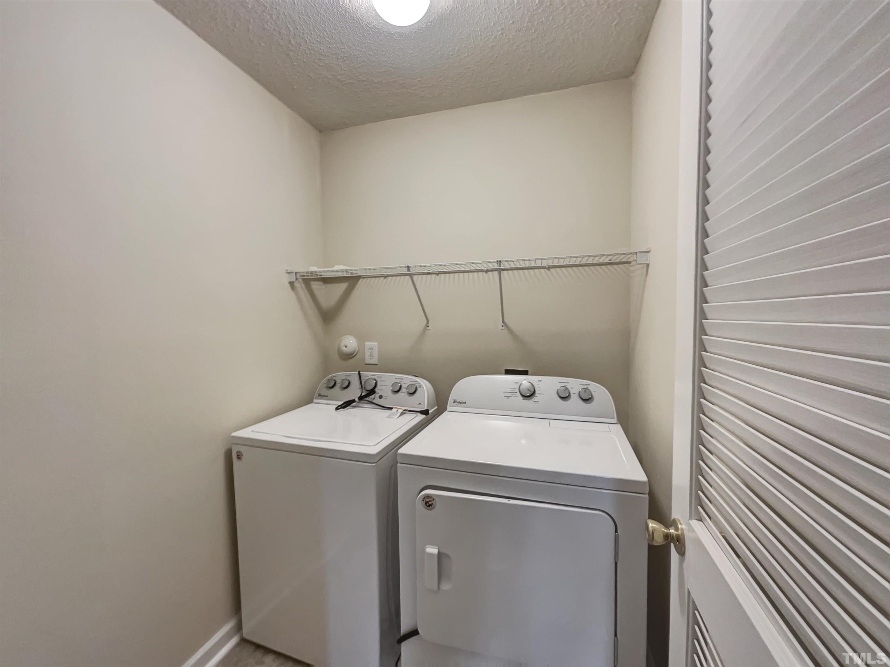 6036 Namozine Court Raleigh, NC 27610 - Photo 15 of 19 a utility room with dryer and washer