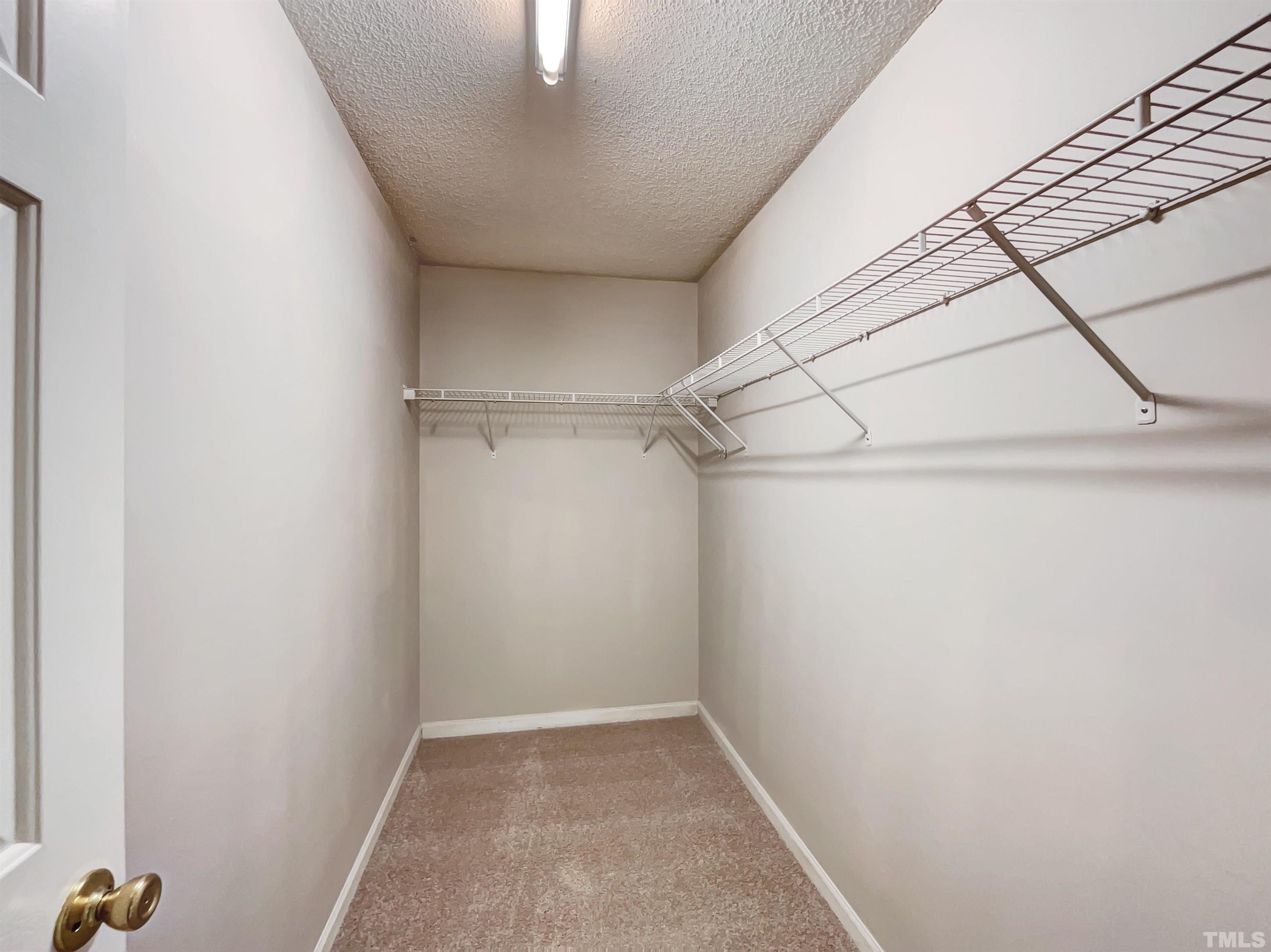 6036 Namozine Court Raleigh, NC 27610 - Photo 18 of 19 a view of a room with racks on the wall