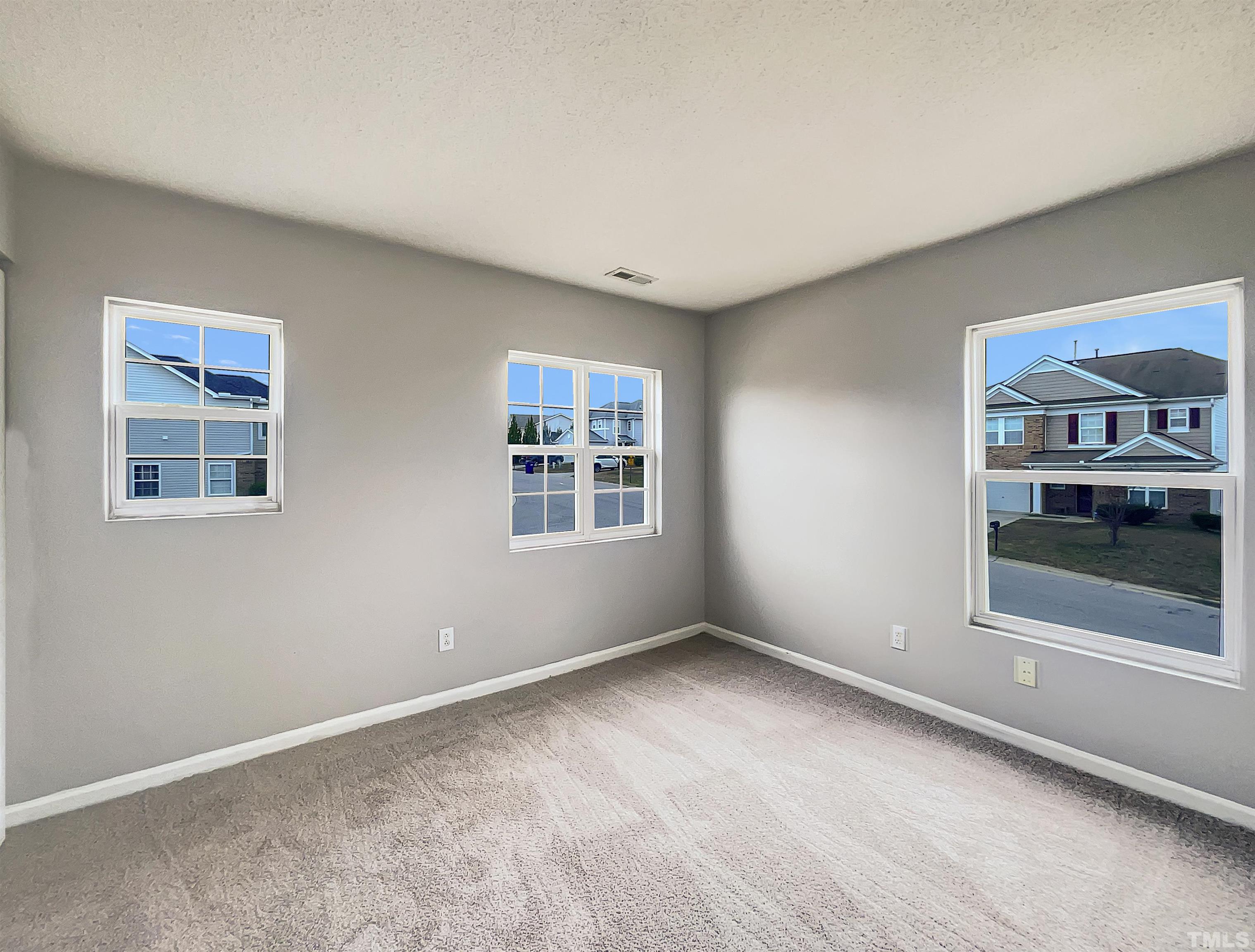 6036 Namozine Court Raleigh, NC 27610 - Photo 5 of 19 a view of an empty room with a window