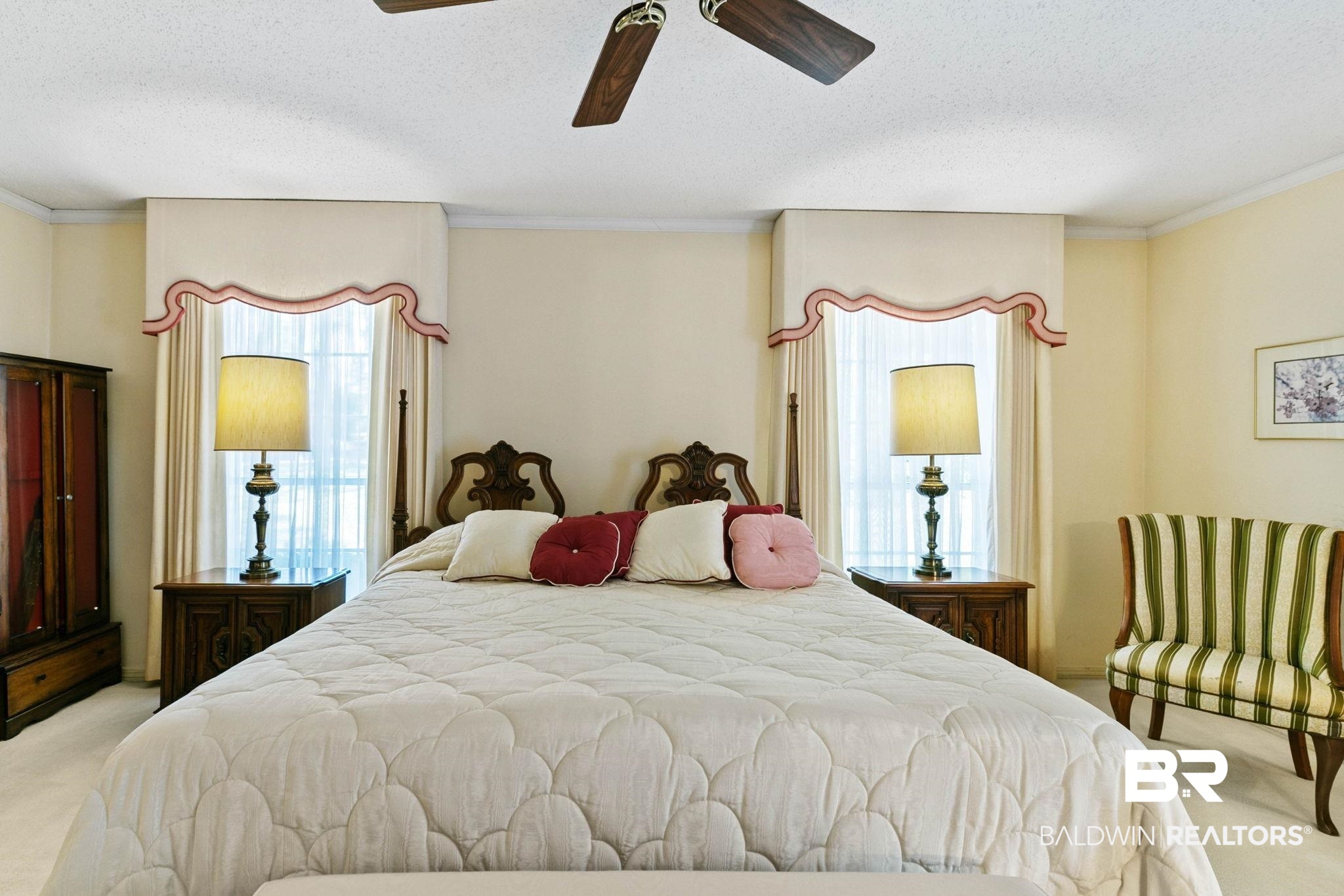 752 Evergreen Street Fairhope, AL 36532 - Photo 27 of 100 Bedroom with light colored carpet, multiple windows, ornamental molding, a textured ceiling, and a ceiling fan