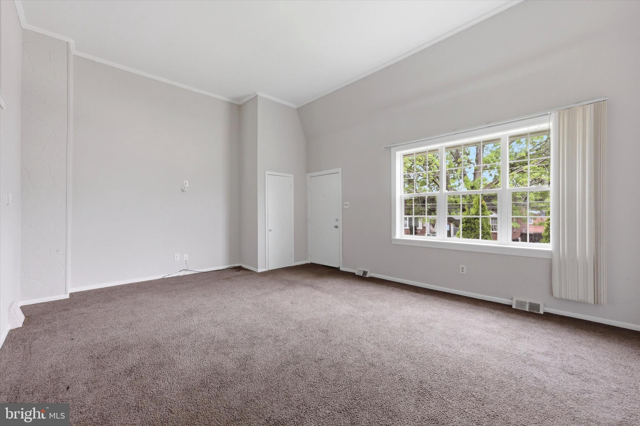 151 Chadwick Avenue Marcus Hook, PA 19061 - Photo 2 of 14 an empty room with a window