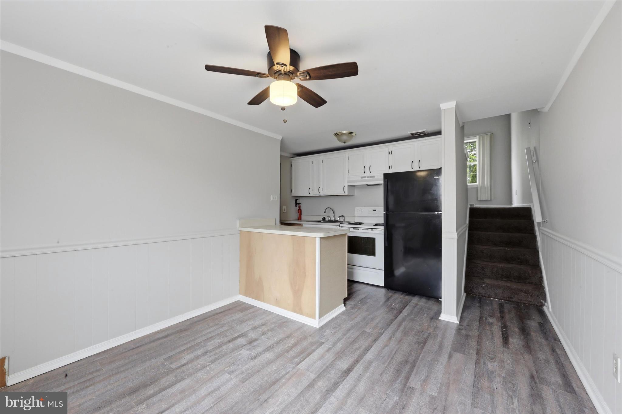 151 Chadwick Avenue Marcus Hook, PA 19061 - Photo 5 of 14 a kitchen with stainless steel appliances a refrigerator and a hard wood floor