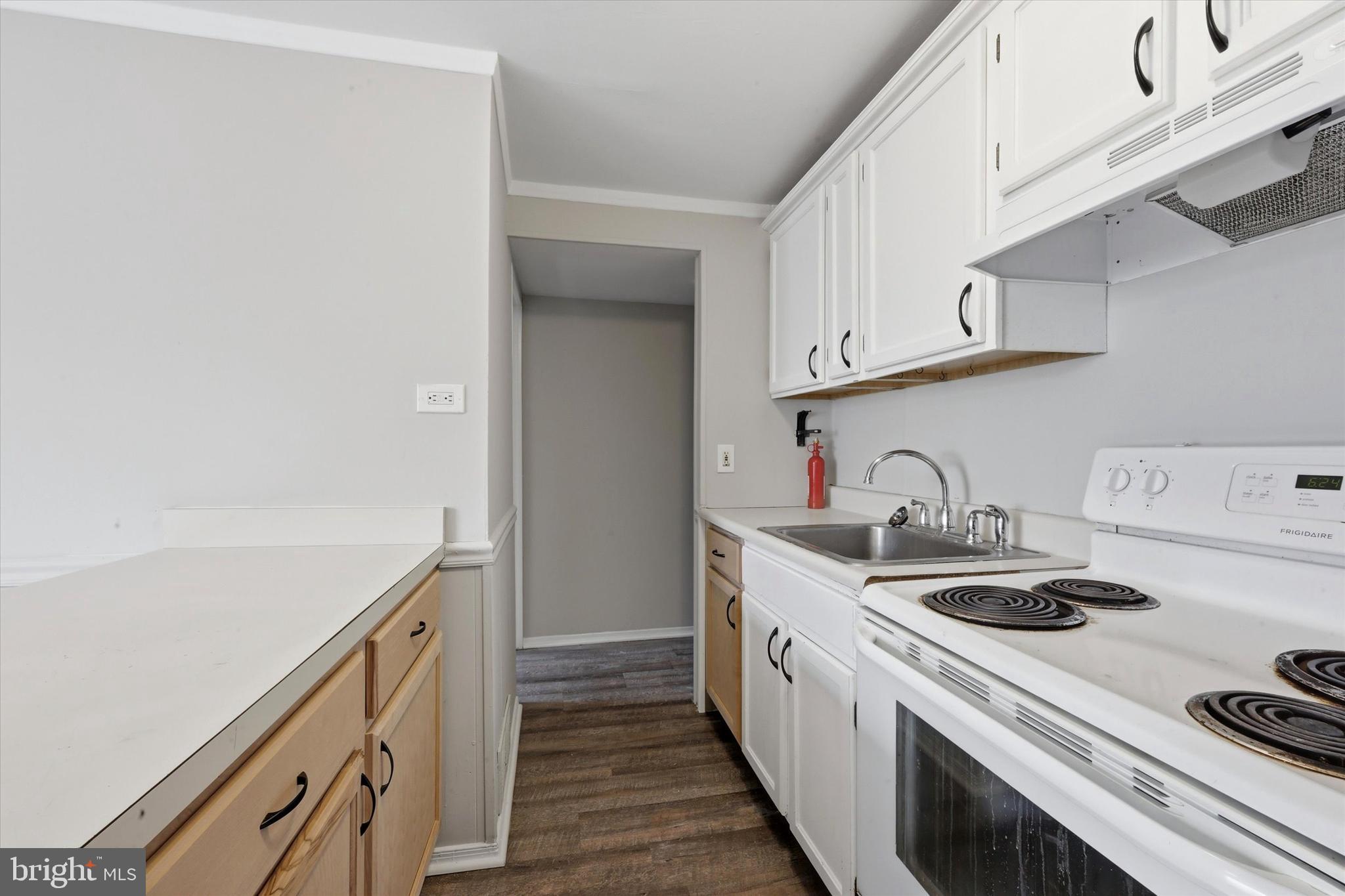 151 Chadwick Avenue Marcus Hook, PA 19061 - Photo 6 of 14 a kitchen with sink a stove and cabinets