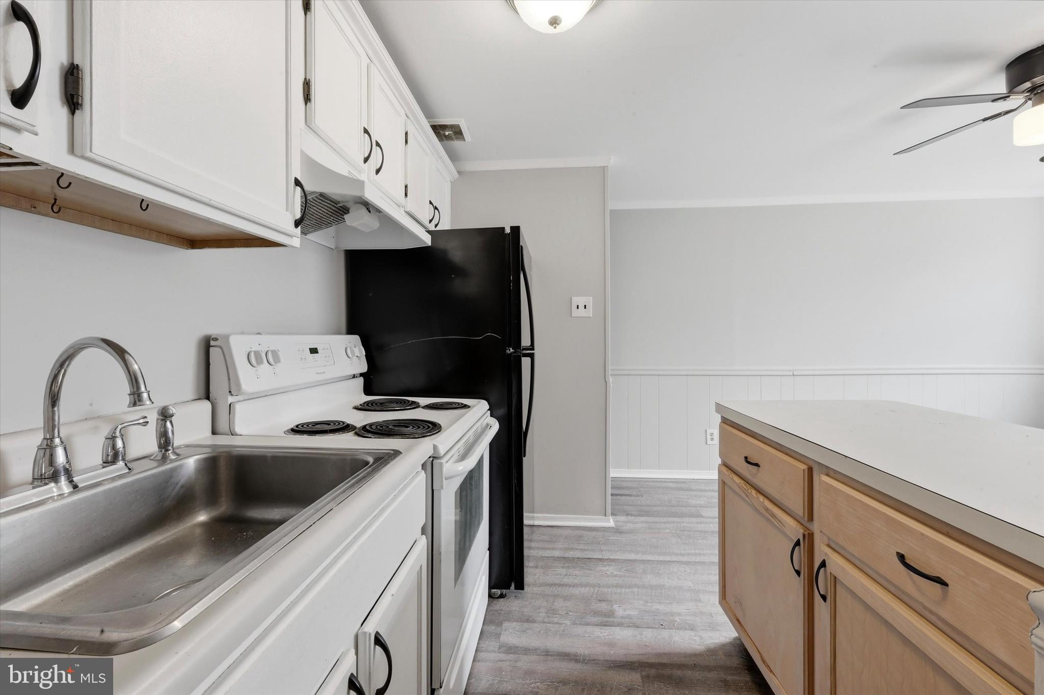 151 Chadwick Avenue Marcus Hook, PA 19061 - Photo 7 of 14 a kitchen with stainless steel appliances granite countertop a sink and a stove