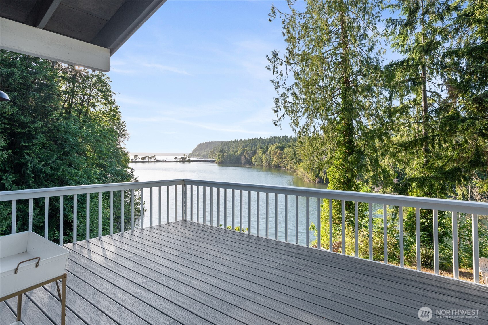 19709 Whiteman Cove Road Southwest Longbranch, WA 98351 - Photo 1 of 40 a view of balcony with wooden floor and fence