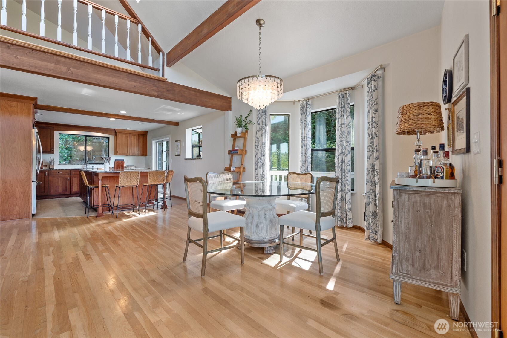 19709 Whiteman Cove Road Southwest Longbranch, WA 98351 - Photo 12 of 40 a view of a dining room with furniture window and wooden floor