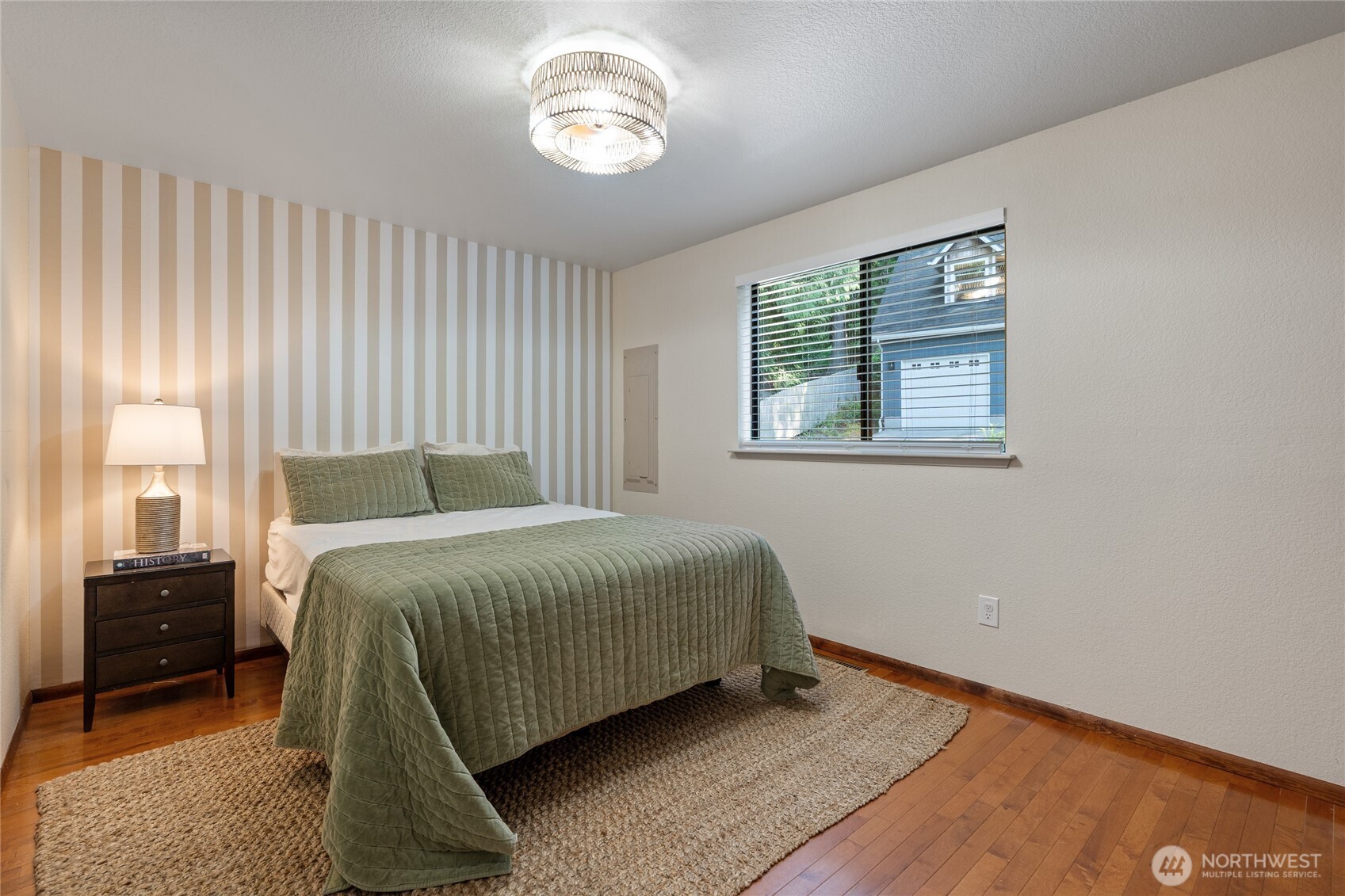 19709 Whiteman Cove Road Southwest Longbranch, WA 98351 - Photo 16 of 40 a bedroom with a bed and a window