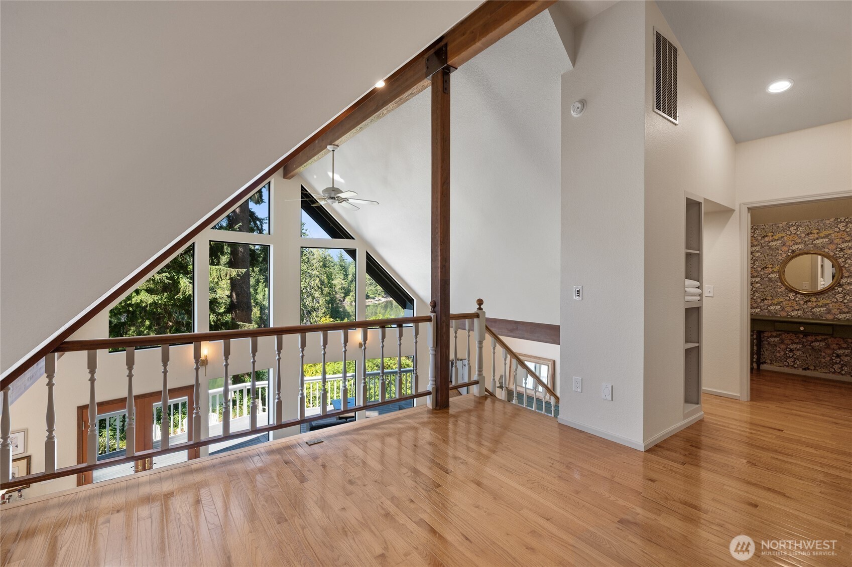 19709 Whiteman Cove Road Southwest Longbranch, WA 98351 - Photo 18 of 40 a view of hallway with wooden floor and stairs