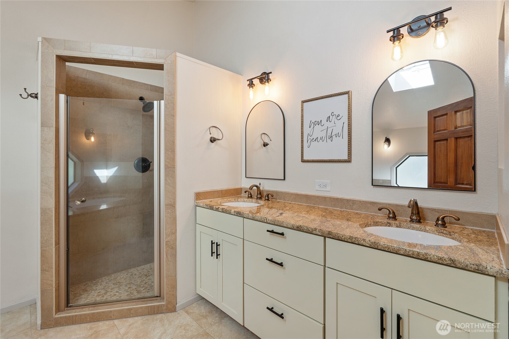 19709 Whiteman Cove Road Southwest Longbranch, WA 98351 - Photo 23 of 40 a bathroom with a granite countertop double vanity sink mirror and shower