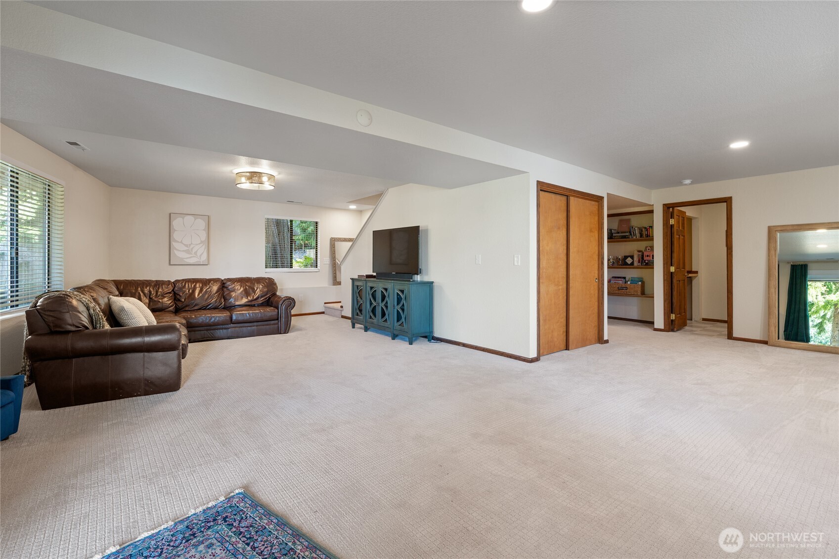 19709 Whiteman Cove Road Southwest Longbranch, WA 98351 - Photo 26 of 40 a living room with furniture and kitchen
