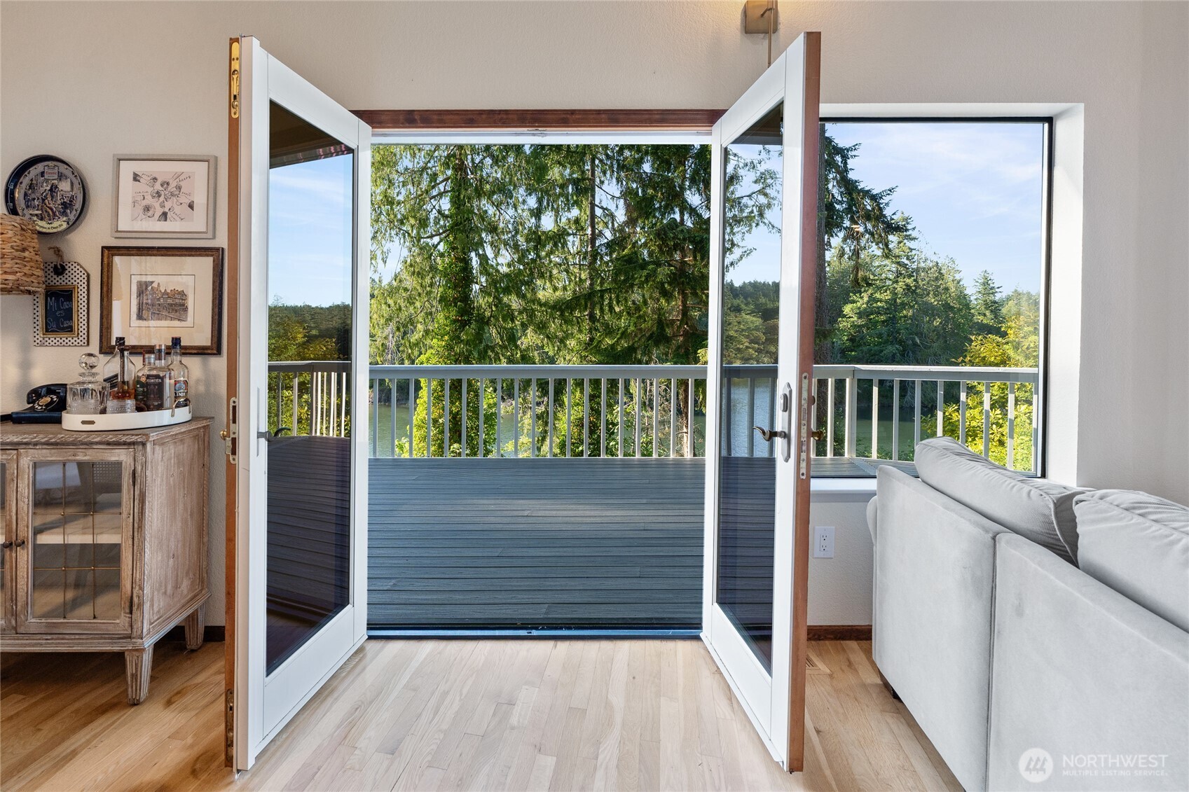 19709 Whiteman Cove Road Southwest Longbranch, WA 98351 - Photo 9 of 40 a view of entryway with a large window and wooden floor