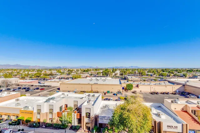 a view of a balcony with chairs