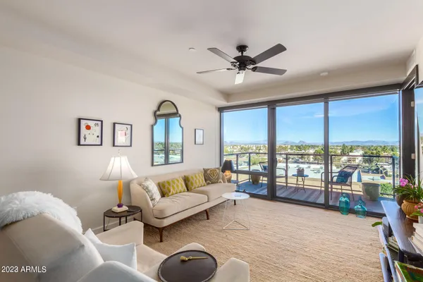 a living room with furniture and a large window