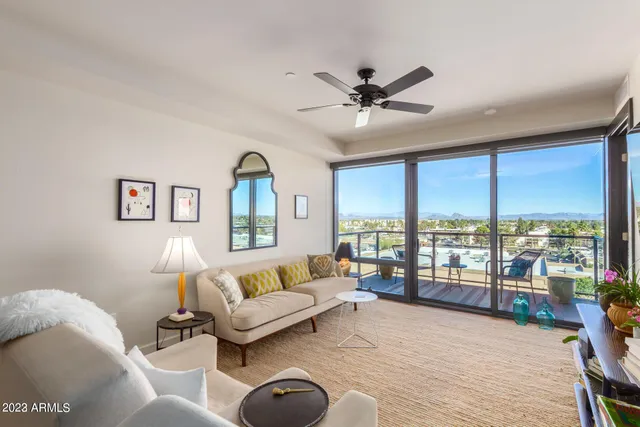 a living room with furniture and a large window