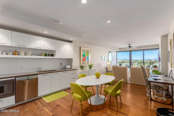 a kitchen with a table and chairs in it