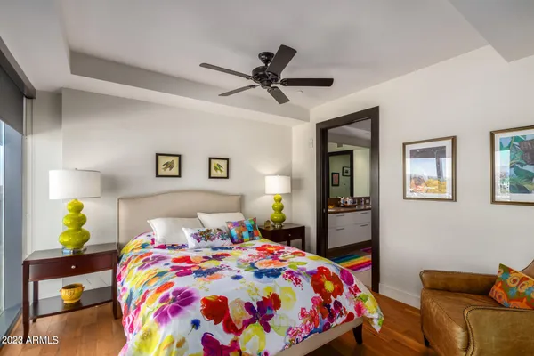 a bedroom with a bed and lamp
