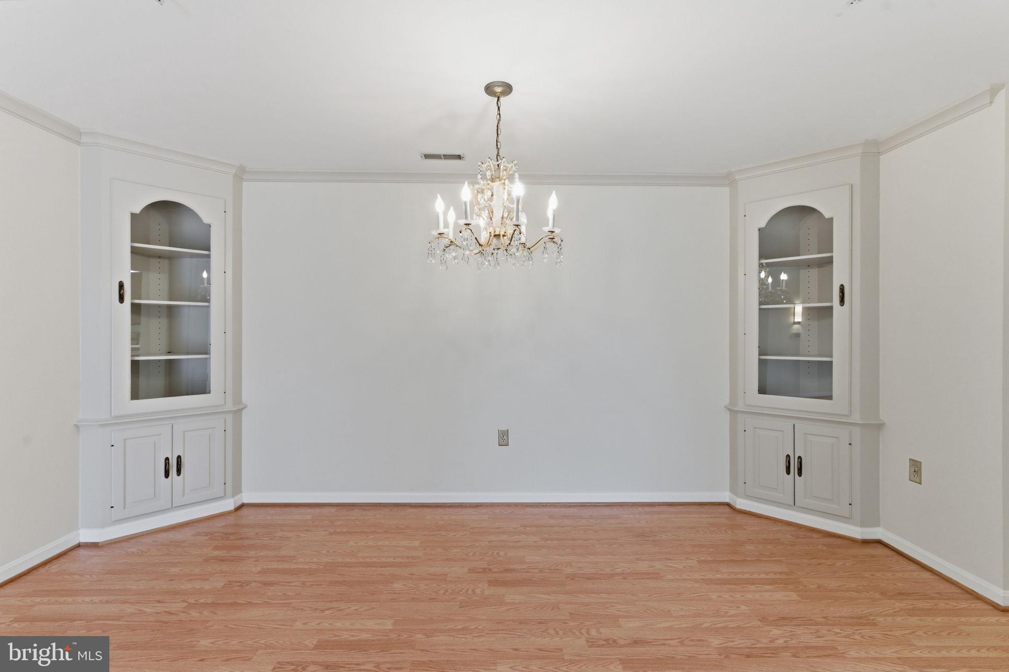 3901 Darleigh Road, Unit 3G Baltimore, MD 21236 - Photo 19 of 41 wooden floor in an empty room with a window