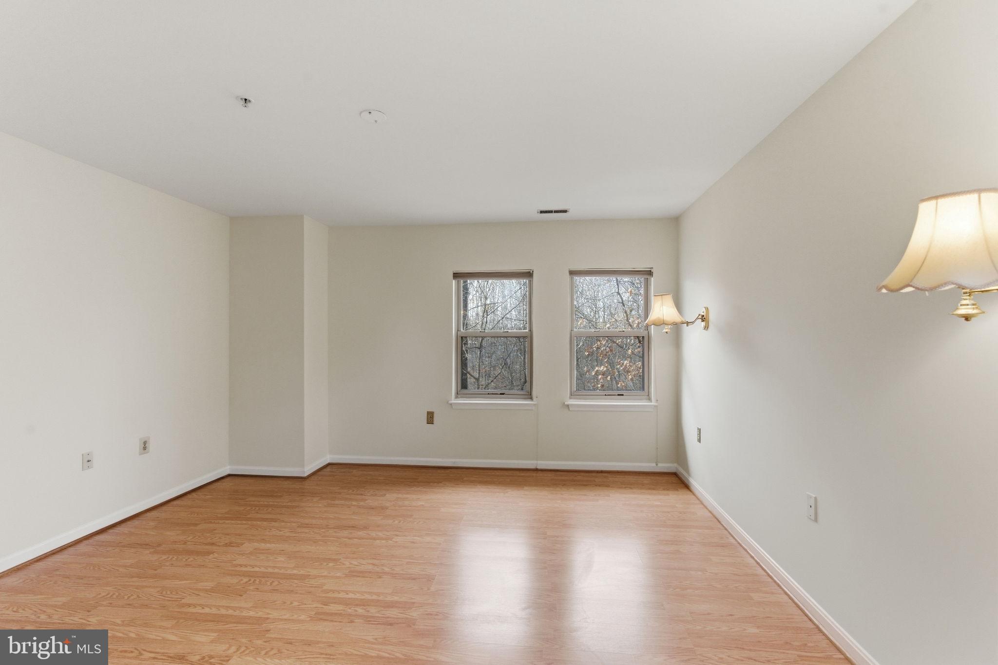 3901 Darleigh Road, Unit 3G Baltimore, MD 21236 - Photo 24 of 41 a view of an empty room with wooden floor and a window
