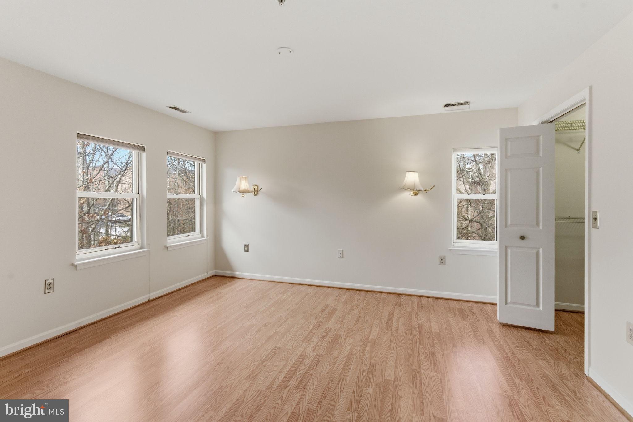 3901 Darleigh Road, Unit 3G Baltimore, MD 21236 - Photo 25 of 41 a view of an empty room with wooden floor and a window