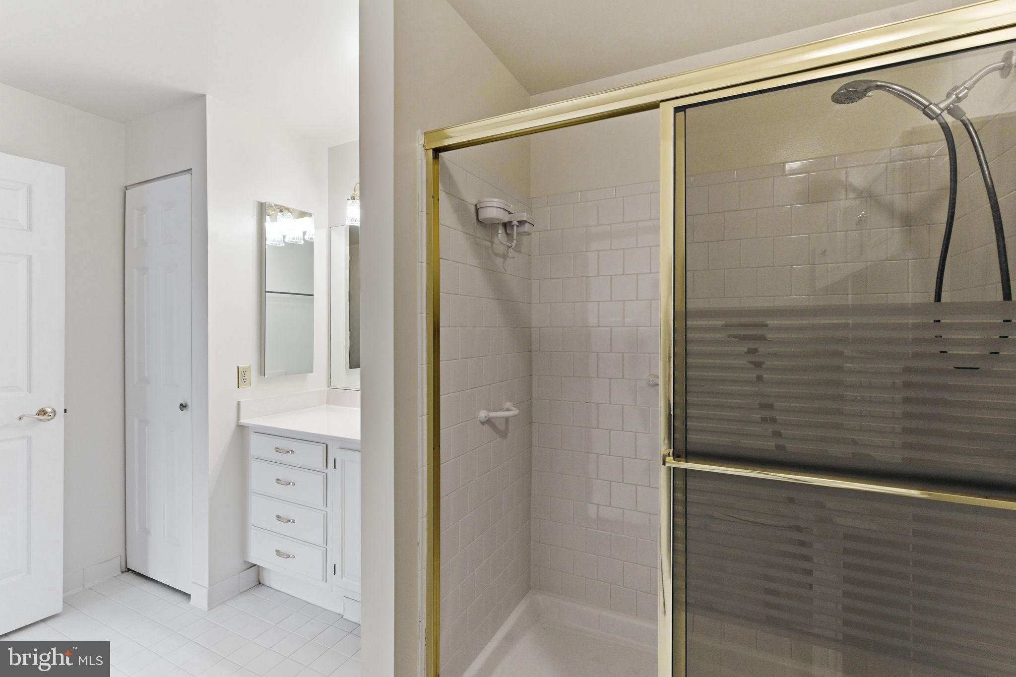 3901 Darleigh Road, Unit 3G Baltimore, MD 21236 - Photo 28 of 41 a bathroom with a glass shower door