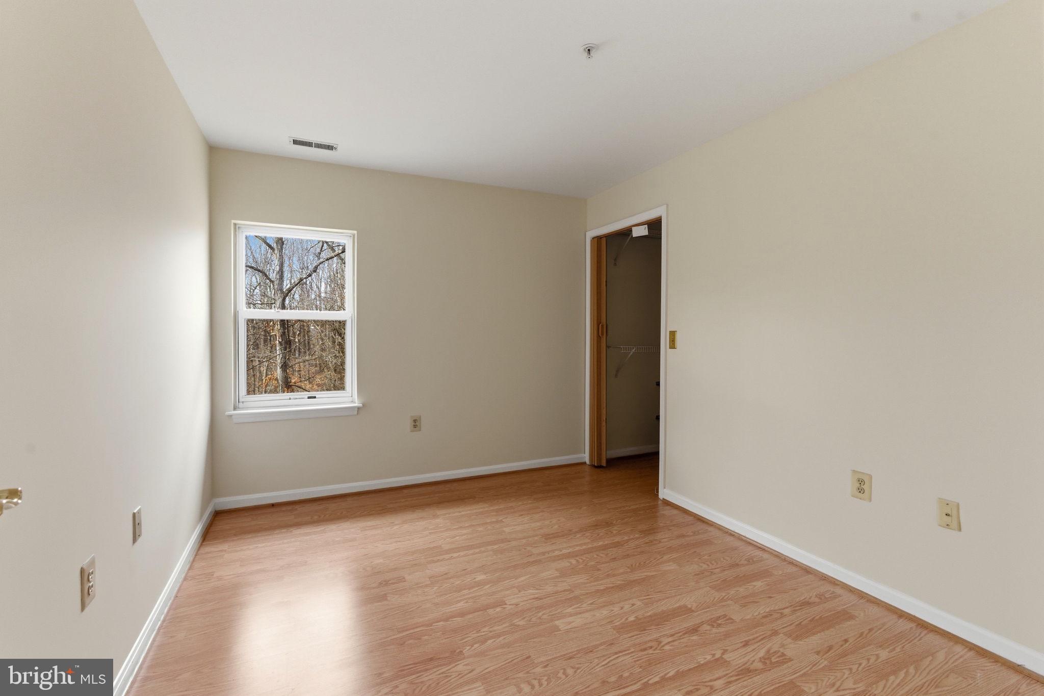 3901 Darleigh Road, Unit 3G Baltimore, MD 21236 - Photo 34 of 41 an empty room with windows and closet
