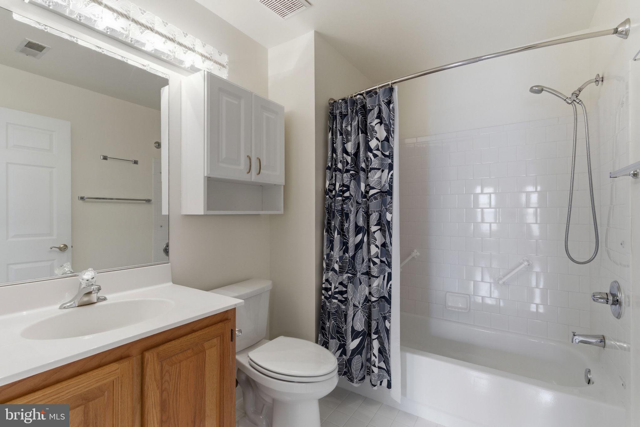 3901 Darleigh Road, Unit 3G Baltimore, MD 21236 - Photo 35 of 41 a bathroom with a sink toilet and shower