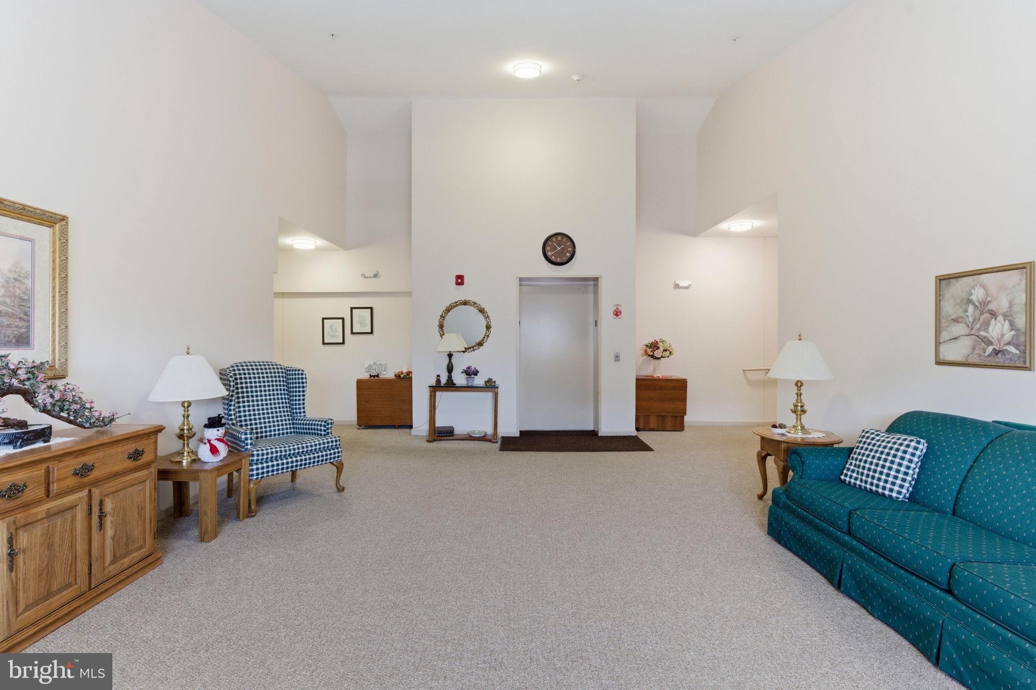 3901 Darleigh Road, Unit 3G Baltimore, MD 21236 - Photo 6 of 41 a living room with furniture and a flat screen tv