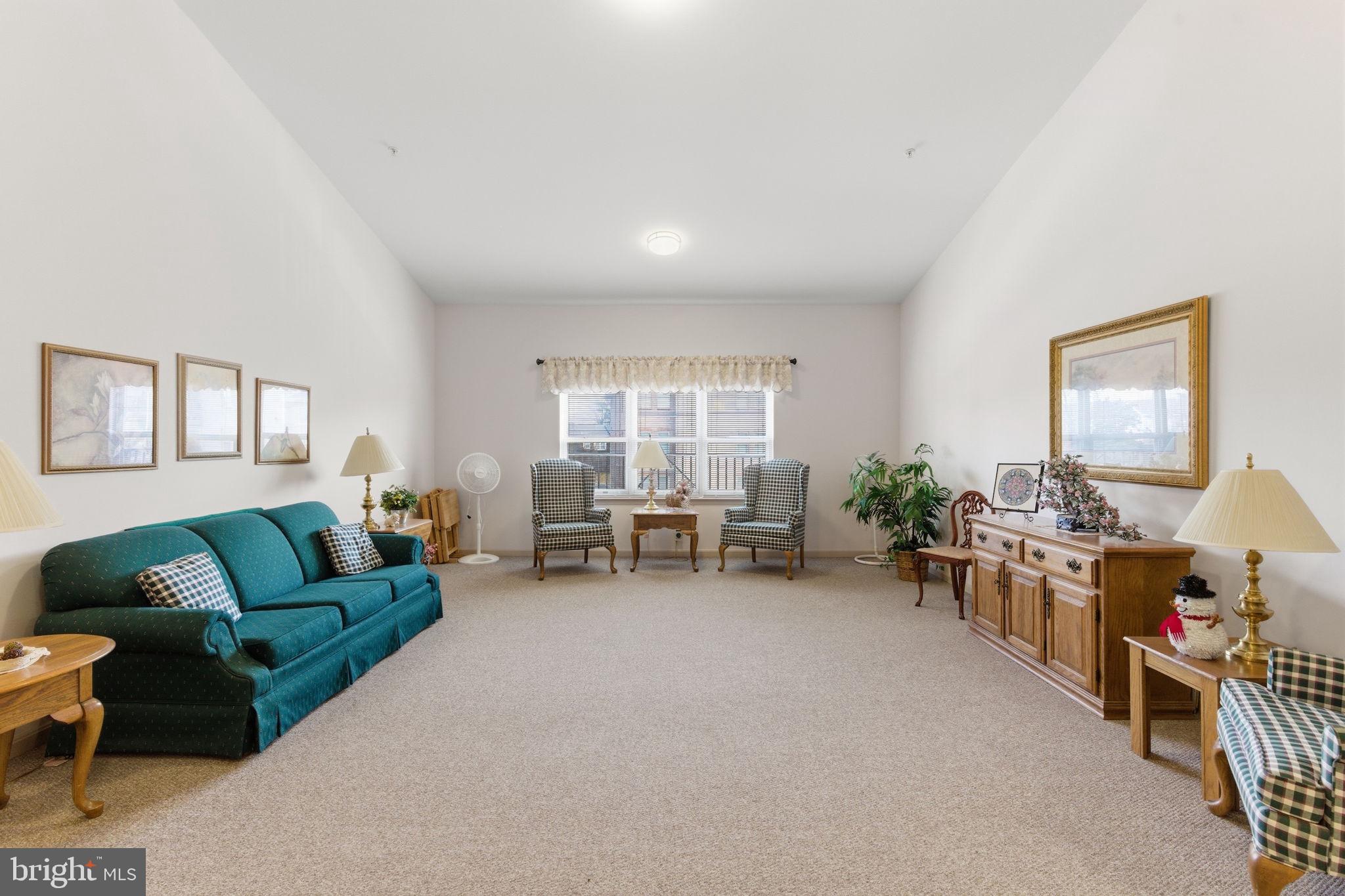 3901 Darleigh Road, Unit 3G Baltimore, MD 21236 - Photo 7 of 41 a living room with furniture and a large window
