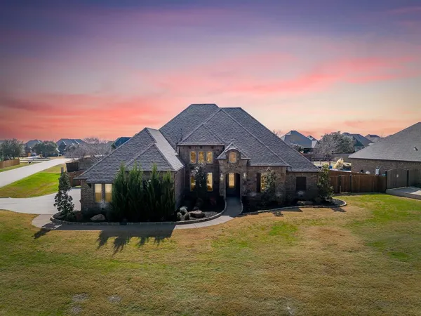 a view of a house with swimming pool and a yard