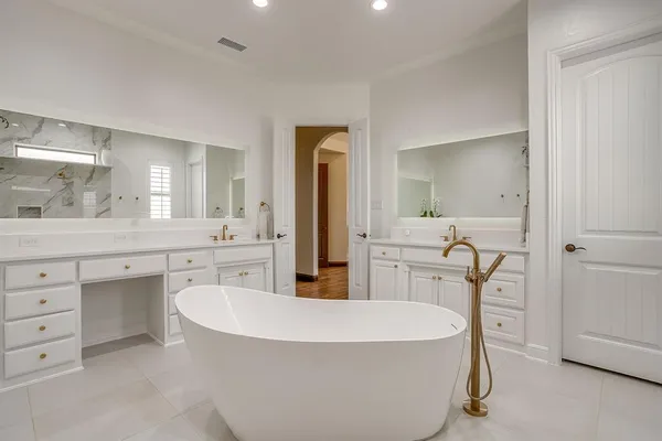 a white bath tub sitting in a bathroom