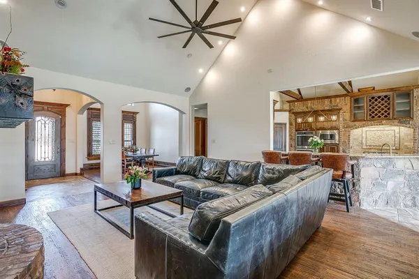 a living room with furniture fireplace and flat screen tv