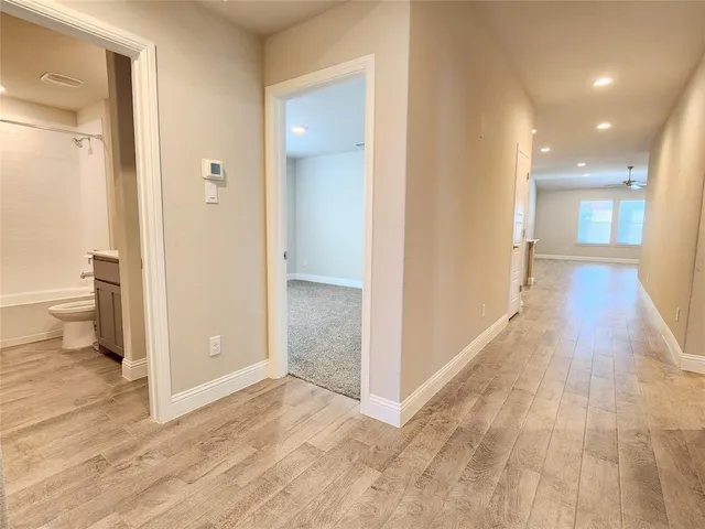 a kitchen with a sink a stove top oven and white kitchen
