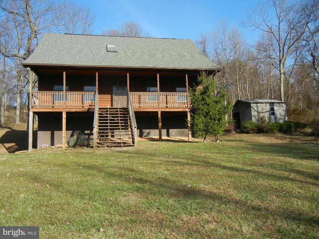 4437 Remount Road Front Royal, VA 22630 - Photo 1 of 22 a front view of a house with a garden