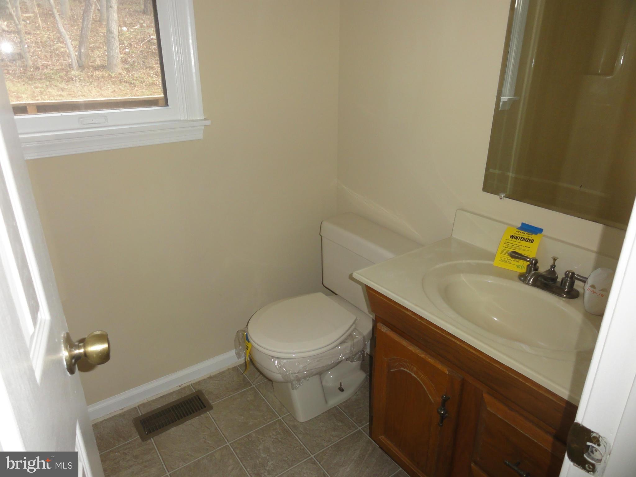 4437 Remount Road Front Royal, VA 22630 - Photo 13 of 22 a bathroom with a sink and a toilet