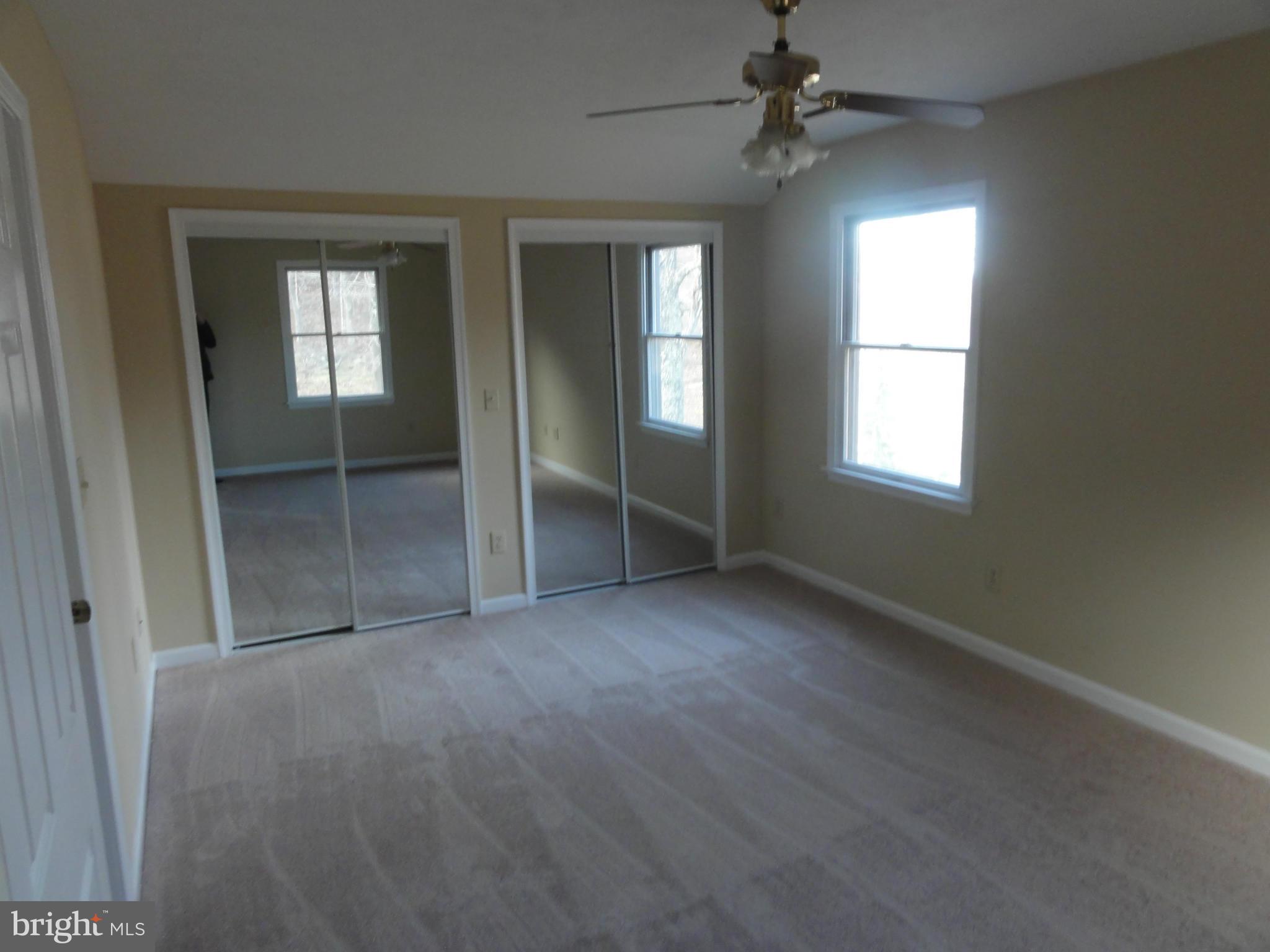 4437 Remount Road Front Royal, VA 22630 - Photo 14 of 22 an empty room with windows and ceiling fan