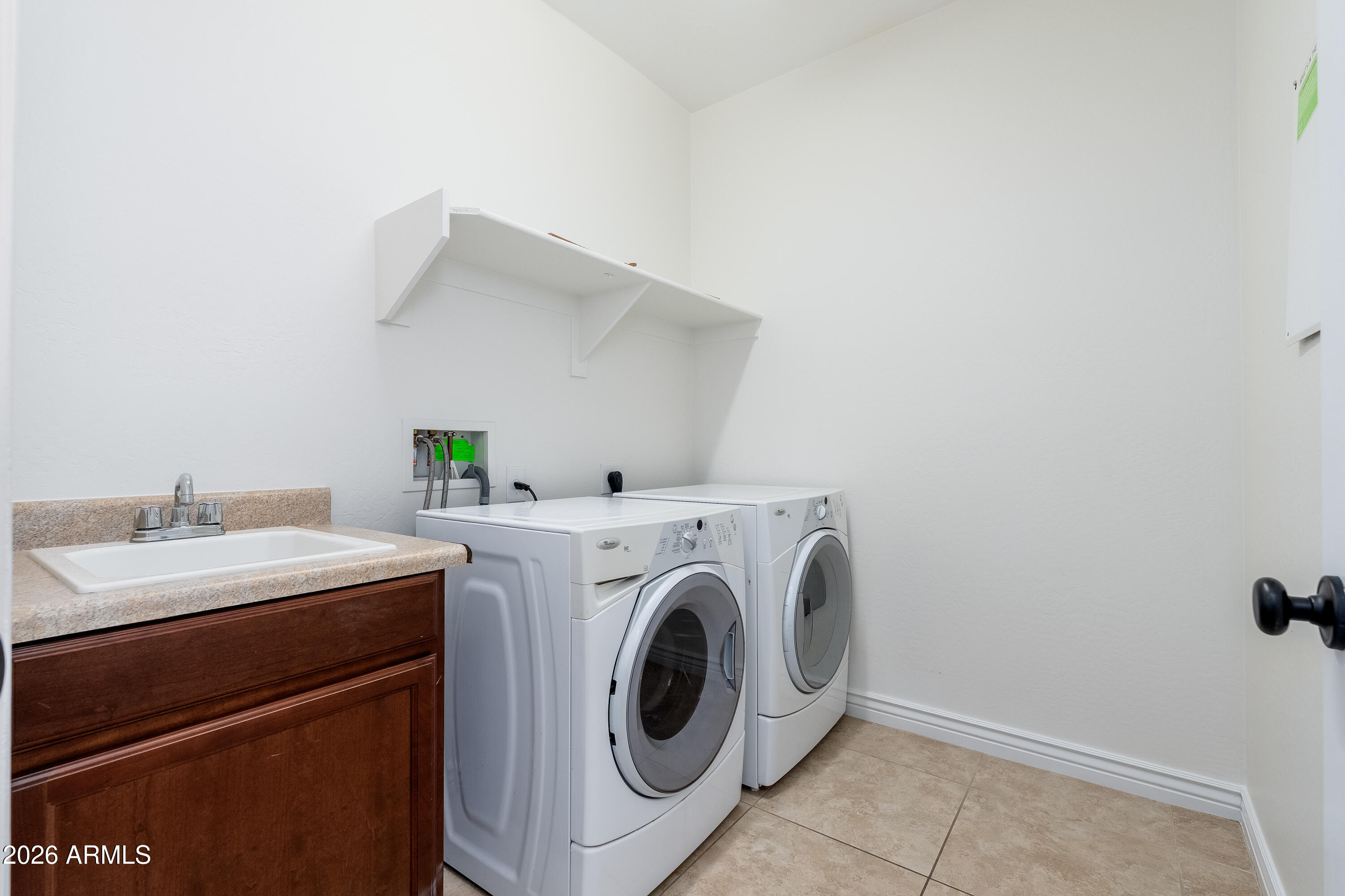 4317 East Folgers Road Phoenix, AZ 85050 - Photo 23 of 40 a utility room with dryer and washer