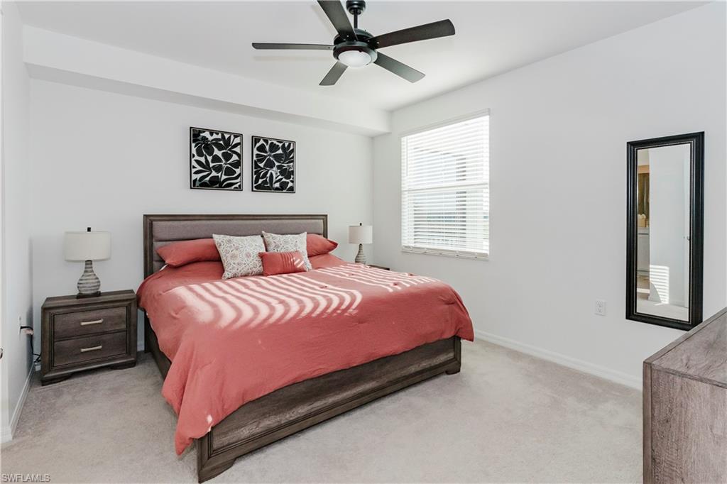 43993 Boardwalk Loop, Unit 1928 Babcock Ranch, FL 33982 - Photo 17 of 50 a bedroom with a bed and a window