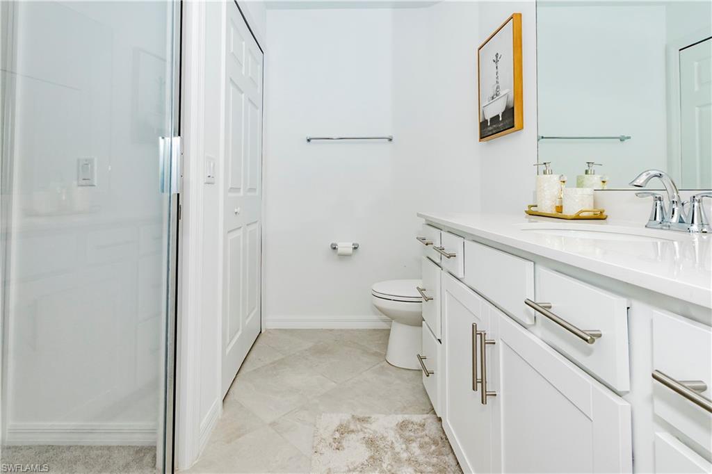 43993 Boardwalk Loop, Unit 1928 Babcock Ranch, FL 33982 - Photo 19 of 50 a bathroom with a sink and a mirror